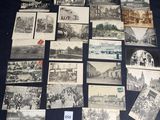 several old black and white photographs of buildings and buildings on a table