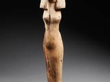 an egyptian carved statue of a woman