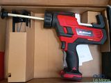 a red and black cordless drill in a box