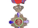 an image of a medal with a crown on top of it