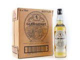 a bottle of glen grant whisky next to a cardboard box
