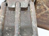 an old metal object that is sitting on a table