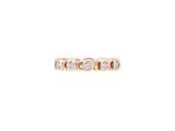 une bague en or rose sertie de trois diamants