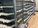 many empty shelves in the store for sale