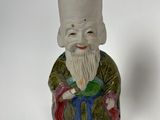 two figurines that are sitting next to each other