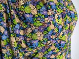 a close up of a dress with a floral pattern on it