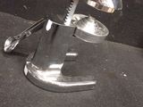 a metal object with a spoon and a knife on it
