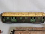 three different types of toy trains on a white surface