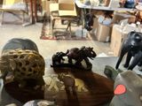 many figurines that are on a table in a room