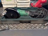 a green machine that is sitting on top of a table