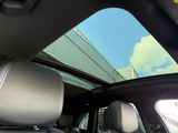 a view of the sunroof from inside of a car
