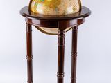 an old globe on a stand with a white background