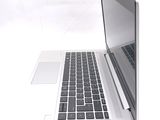 a laptop computer sitting on top of a white table