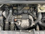 a picture of a car engine with its hood open