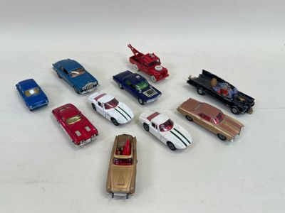 several toy cars are arranged in a circle on a white surface