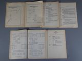 three pages of a book with a diagram on them sitting on a table