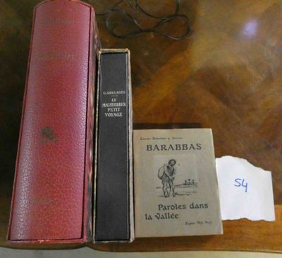 two books sitting on a table next to a pair of glasses