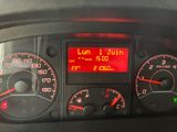 a close up of a car dashboard with a clock on it