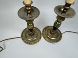 two candles that are sitting on a table