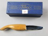 a knife and a box of farol on a table