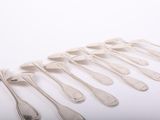 a lot of spoons that are sitting on a table