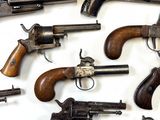 a lot of guns that are on the table