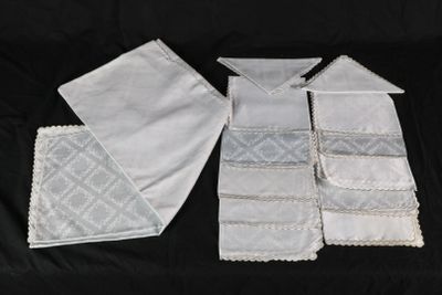 four pieces of white handkerchiefs on a black background