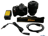 two cameras and a charger on a white background