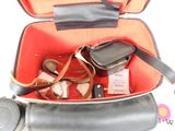 an open suitcase with a bunch of items inside of it