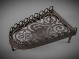 a small metal tray with a decorative design on it