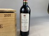 a bottle of wine sitting next to a wooden box
