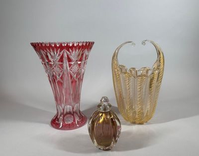 three glass vases sitting next to each other on a table