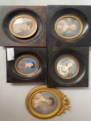 four framed pictures of a woman and a child in a gold frame