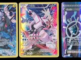 Trois cartes Pokémon différentes sont représentées sur un fond noir.