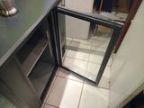 a glass door that is open in a kitchen