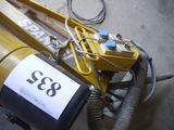 a machine that is sitting on the ground with a sign on it