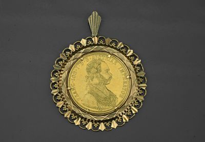 an image of a gold coin with a woman ' s face in the center