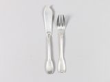 two forks and a spoon on a white surface