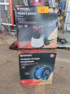 two boxes of tools are stacked on top of each other in a garage