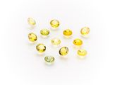 a group of yellow sapphires on a white background