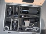 a metal case with many different types of cameras in it