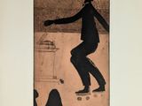 a picture of a man riding a skateboard on the street