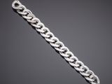 a silver chain bracelet with a clasp on a gray background