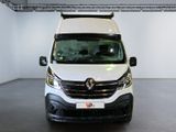 the front of a white van parked in a garage