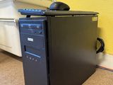 a black desktop computer sitting on top of a desk