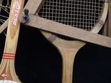 two tennis rackets sitting next to each other on a table