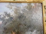 une photo d'un tableau représentant un arbre, dans un cadre doré