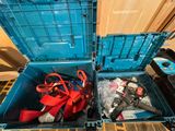 a blue box with tools inside of it on the floor