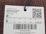 a close up of a brown sweater with a tag on it