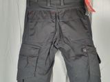 a close up of a pair of grey cargo pants on a white background